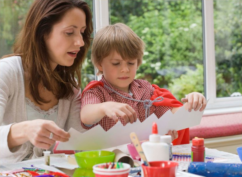 Child making crown with parent_8